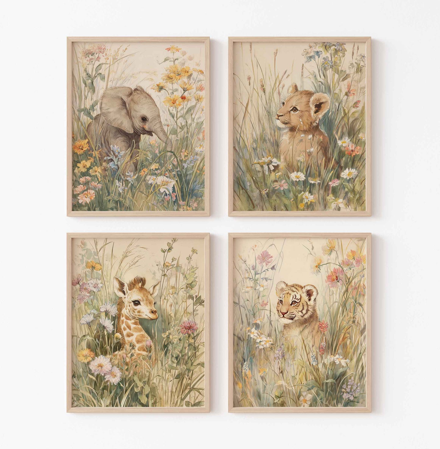 Set of four vintage nursery prints with baby elephant, lion cub, giraffe, and tiger cub sitting in wildflowers and tall safari grass