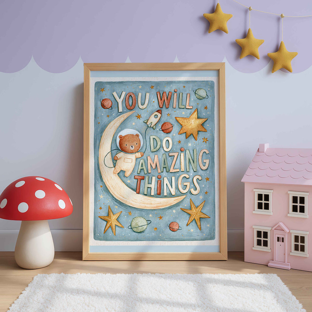 Retro space wall art of an astronaut bear floating by a crescent moon with planets, stars and a tiny rocket, lettered You Will Do Amazing Things