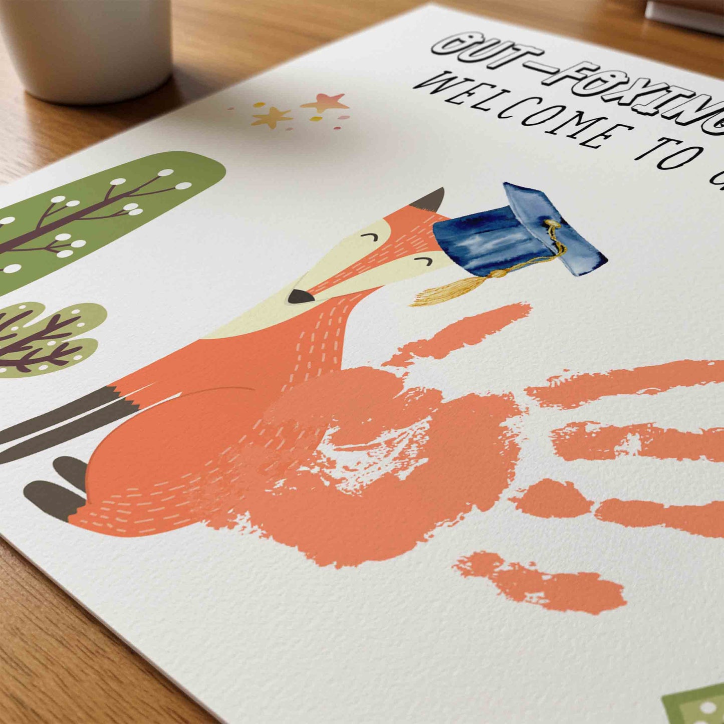 Children's greeting card with a fox illustration and handprints on a wooden surface.