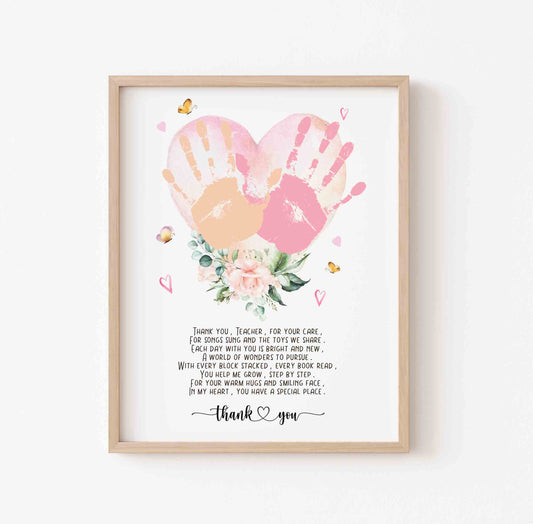 Framed artwork with handprints, flowers, and a heartfelt message on a white background