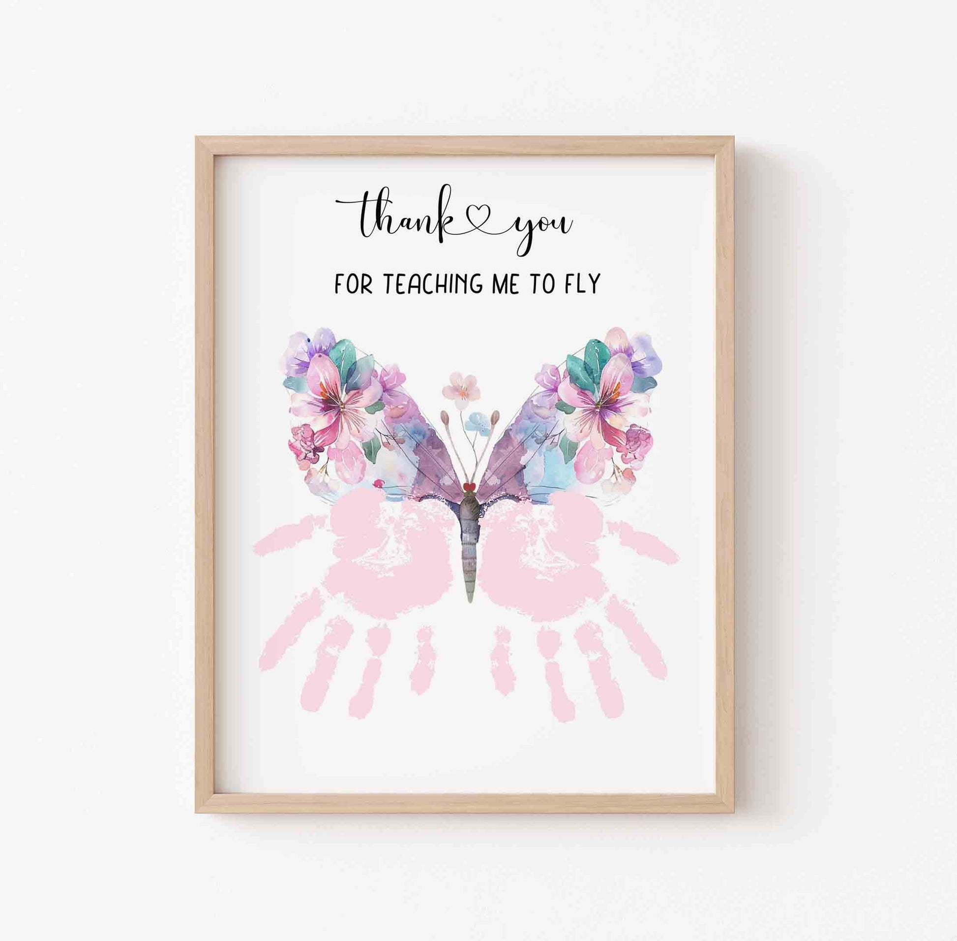 Framed artwork with butterfly design and text on a white background