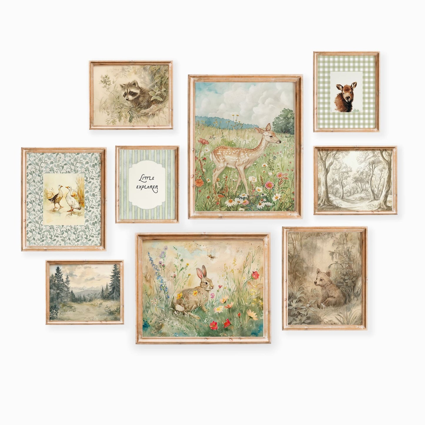 Sweet woodland nursery gallery wall with nine framed prints showing forest animals like deer, rabbits, and raccoons in soft vintage watercolor style on a white wall