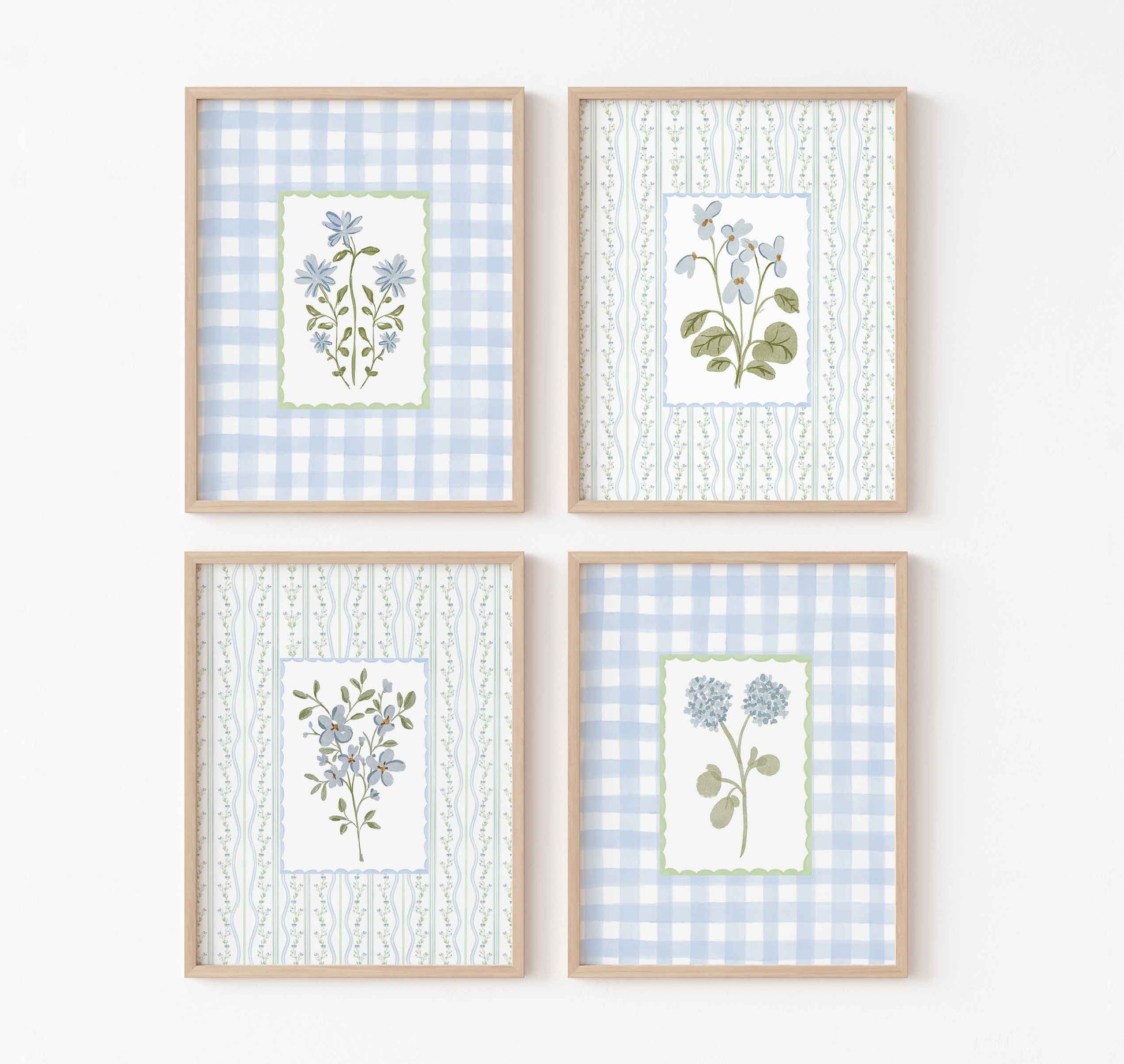 Four-piece grandmillennial nursery wall art set with blue floral illustrations on gingham and striped backgrounds in a coastal grandmother style
