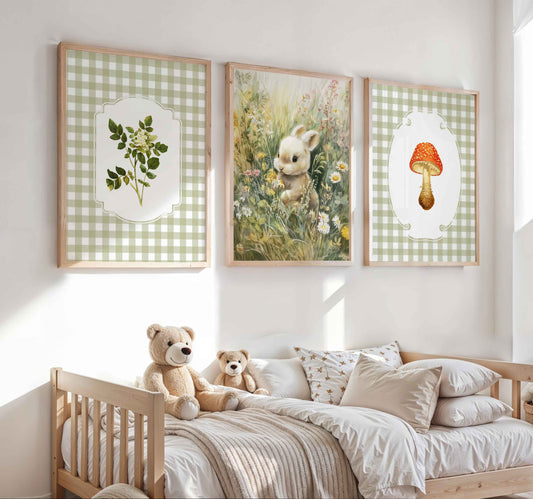 Three-piece cottagecore nursery art set with sage green gingham background featuring botanical fern, watercolor bunny in wildflower meadow, and red spotted mushroom illustration in natural wood frames