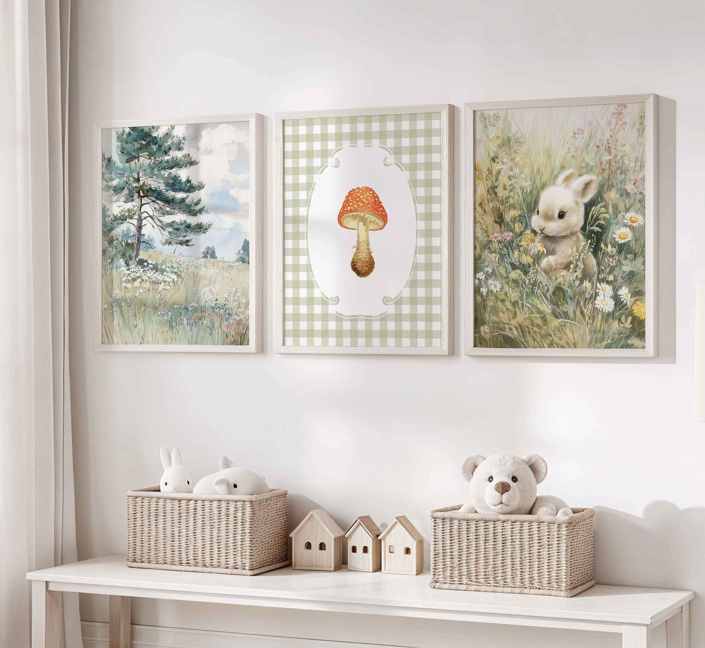 Three-piece cottagecore nursery art set featuring watercolor pine tree landscape, red spotted mushroom on sage gingham background, and bunny in wildflower meadow in white wooden frames
