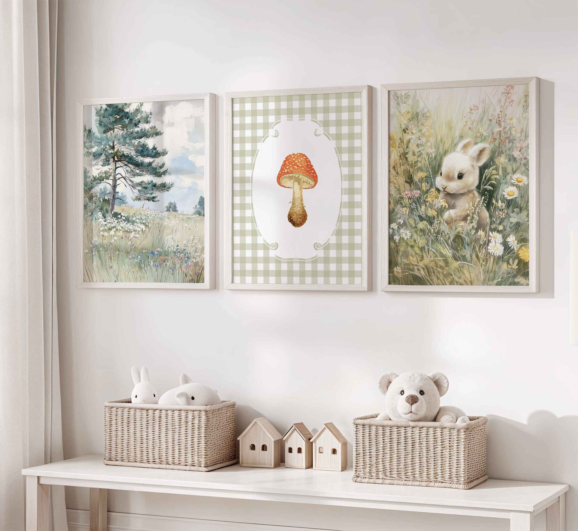Three-piece cottagecore nursery art set featuring watercolor pine tree landscape, red spotted mushroom on sage gingham background, and bunny in wildflower meadow in white wooden frames
