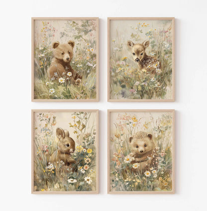 Set of four vintage-style nursery prints with baby bear, deer, bunny, and hedgehog sitting in wildflowers and tall meadow grass