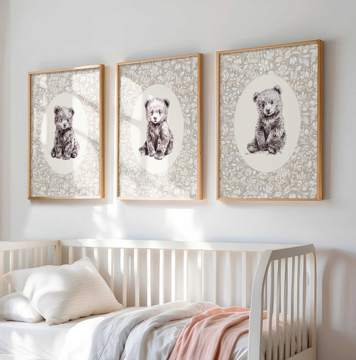 Three-piece vintage nursery art set featuring detailed pen and ink sketches of three bear cubs in different poses on cream backgrounds with delicate taupe floral botanical pattern in natural wood frames