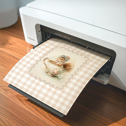 Vintage printable nursery art of a squirrel in a teacup with bonnet, beige gingham background, woodland animal wall decor.