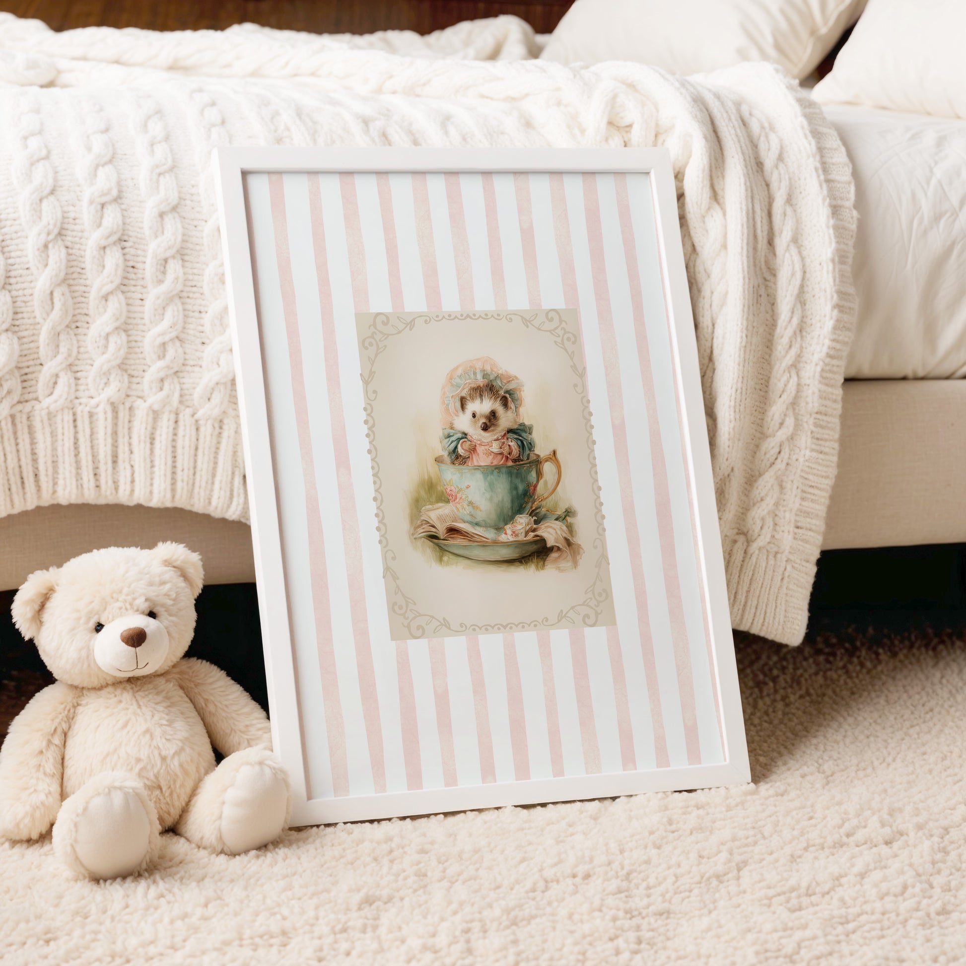 Printable wall art of a vintage hedgehog in a teacup with bonnet and books, pink striped background, cottagecore woodland nursery décor.