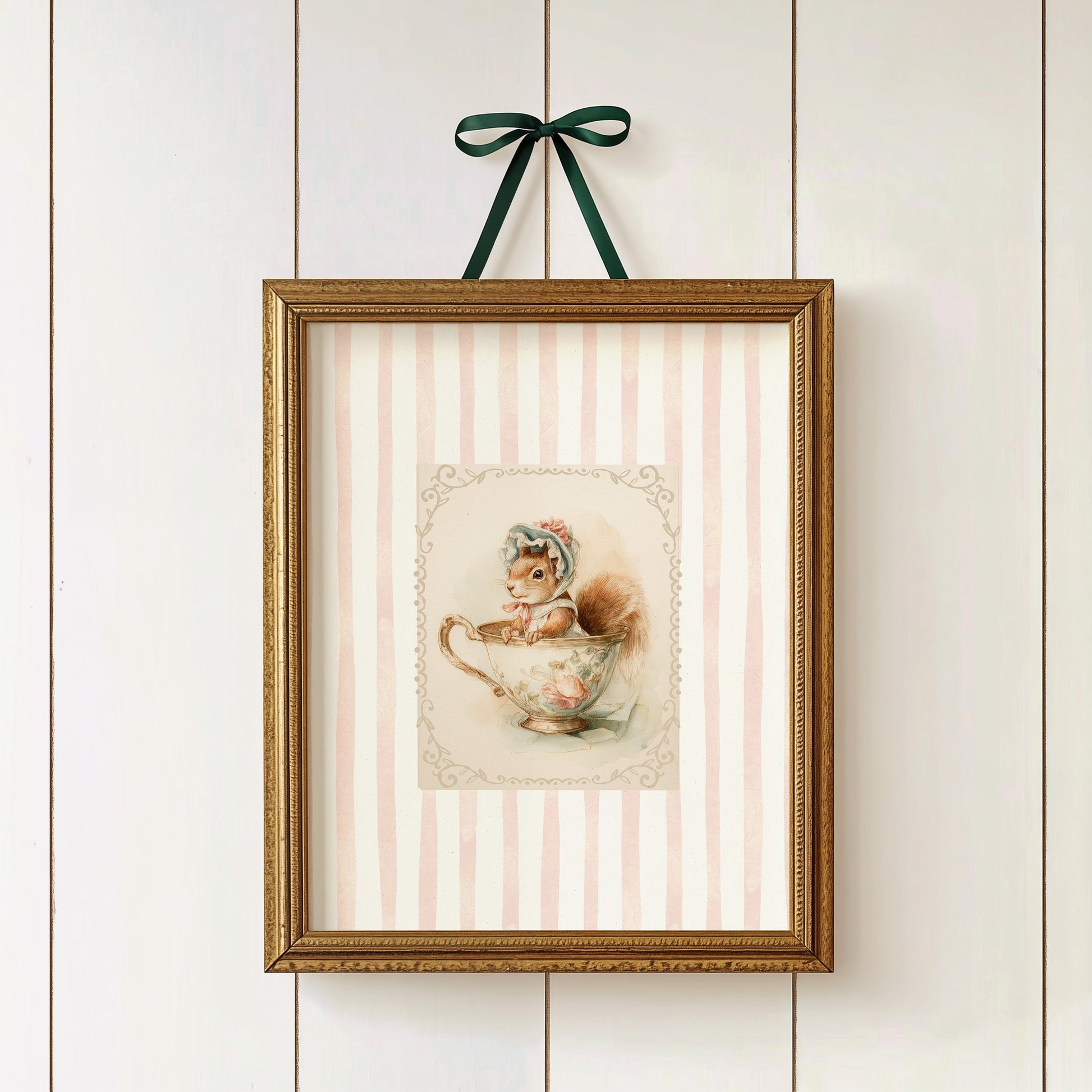 Printable nursery art of a vintage squirrel in a teacup with bonnet, pink stripe background, woodland animal theme for girl’s room.