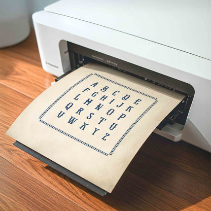 Hand lettered alphabet chart print styled being printed for a baseball nursery room