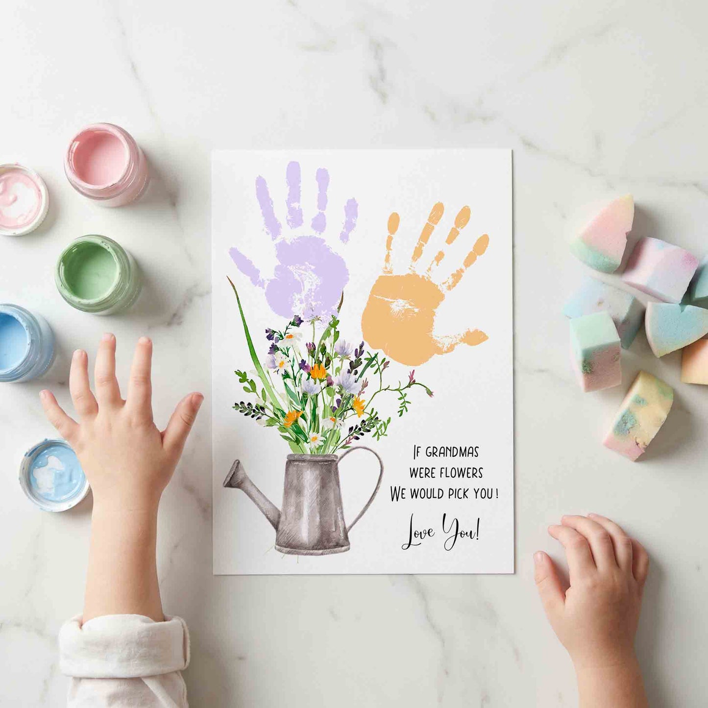 Family handprint keepsake template with a watering can and wildflowers