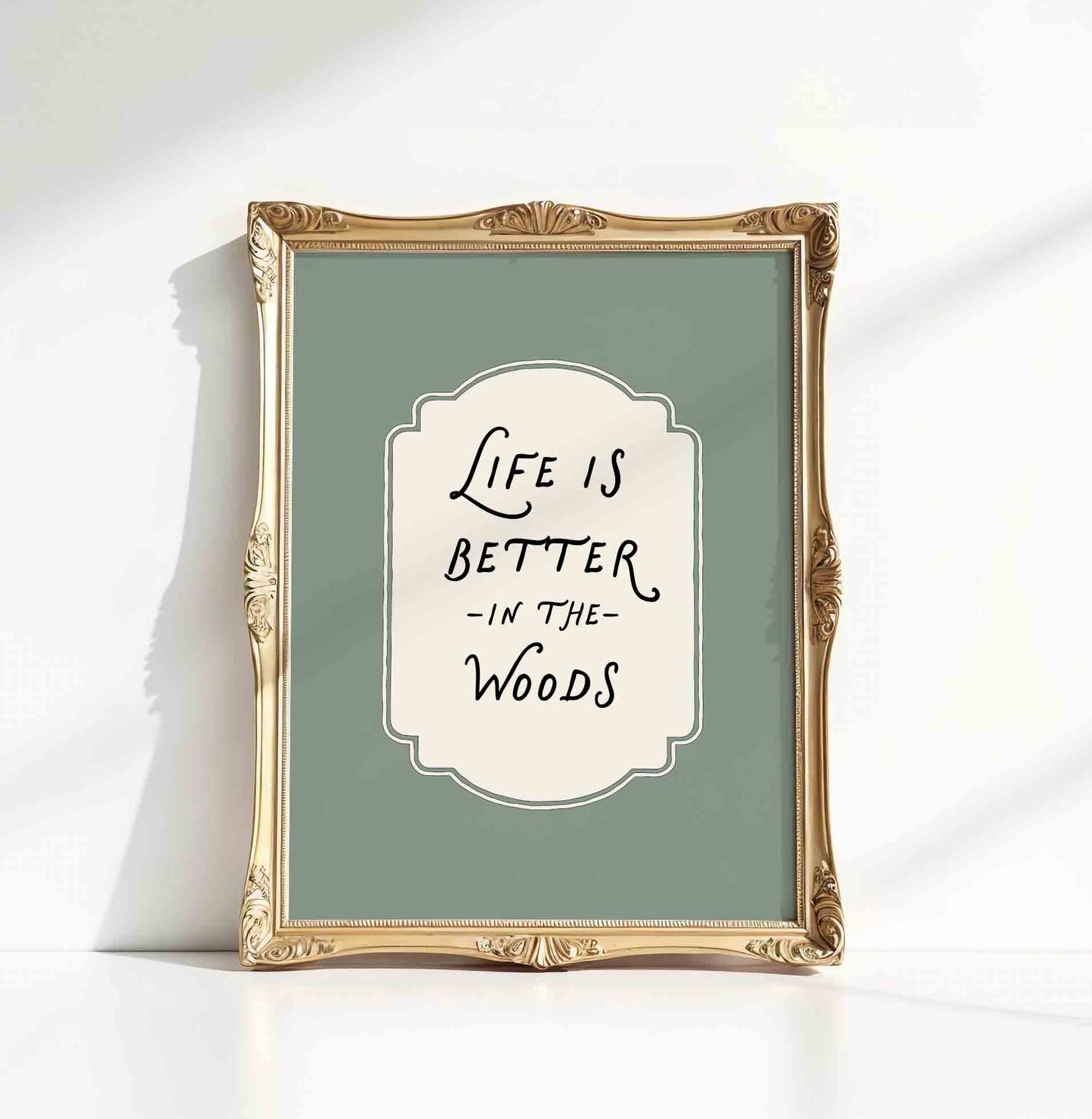 Life is better in the woods typography print close up styled for a woodland nursery room