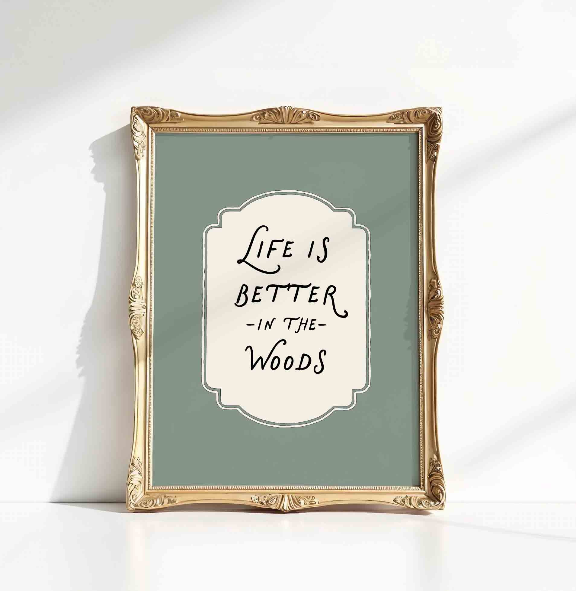 Life is better in the woods typography print close up styled for a woodland nursery room