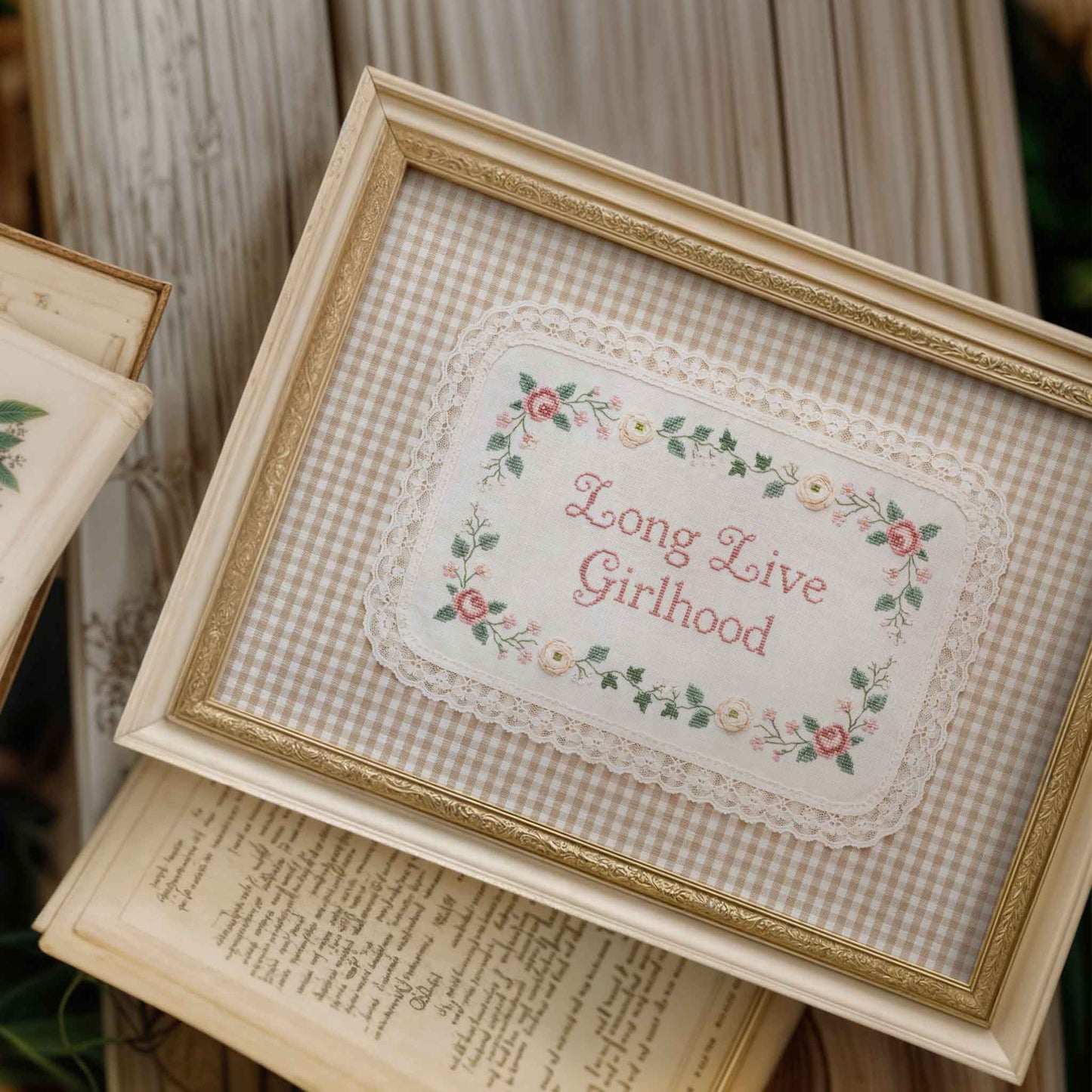 Long Live Girlhood nursery sign with cross stitch style lettering and floral trim