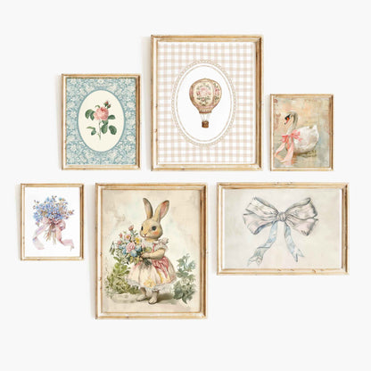 Six-piece whimsical vintage cottagecore nursery wall art gallery with a hot air balloon, rabbit illustration, florals, bow artwork, and a swan portrait.
