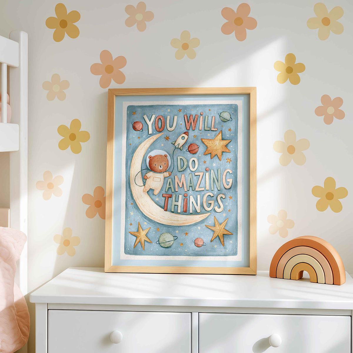 Retro wall art pairing an astronaut bear beside a glowing crescent moon with planets and a tiny rocket