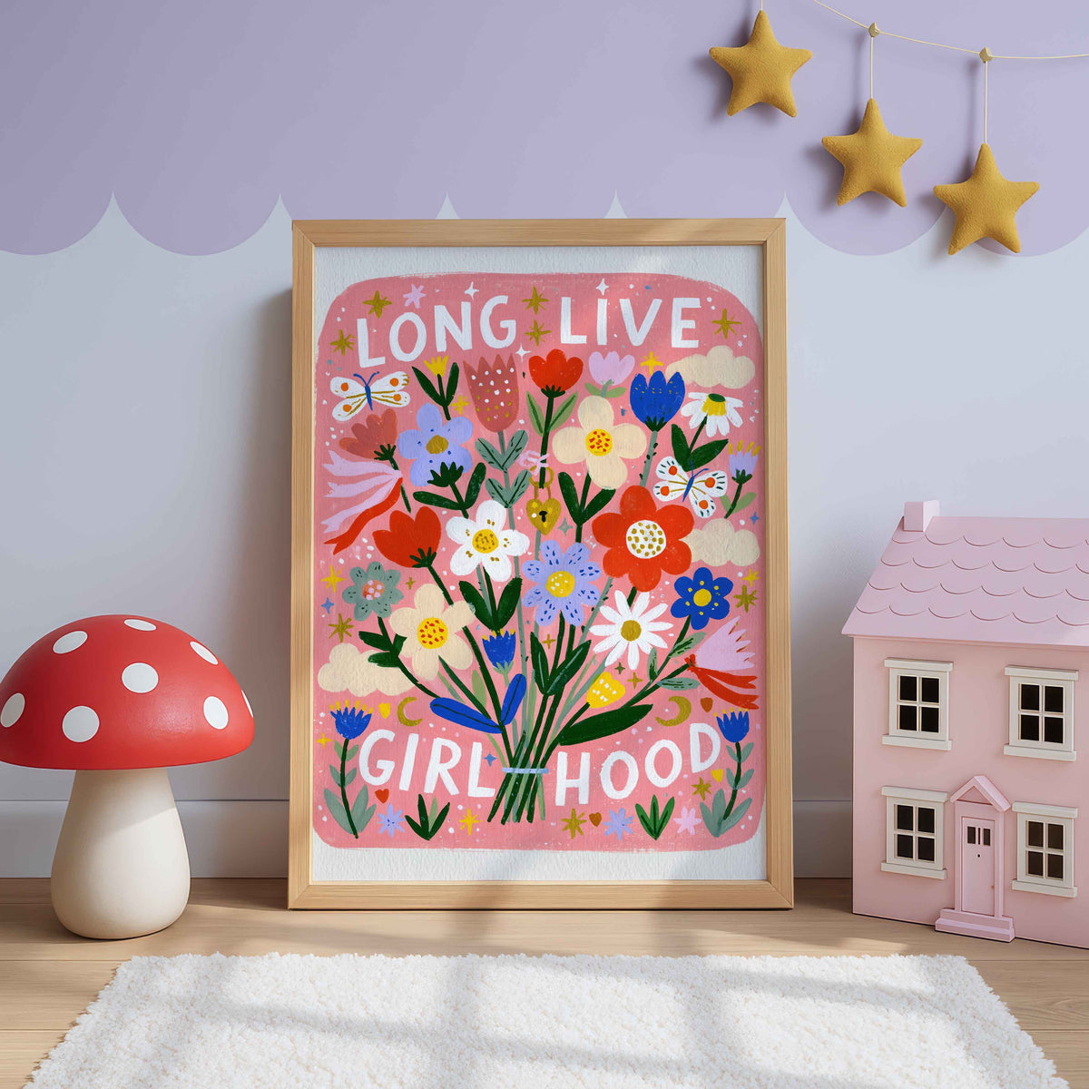 Retro bouquet wall art with red tulips, blue blooms and daisies on coral pink, lettered Long Live Girlhood