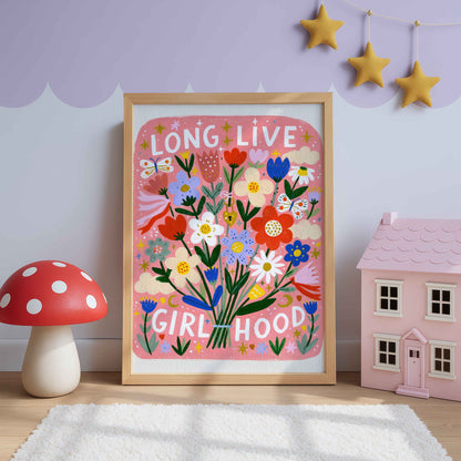 Retro bouquet wall art with red tulips, blue blooms and daisies on coral pink, lettered Long Live Girlhood