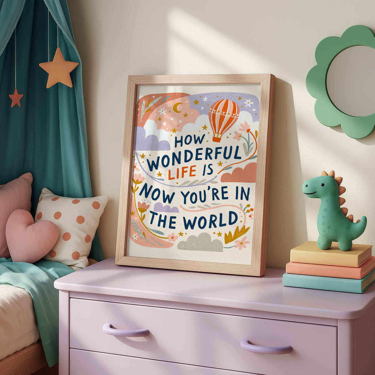 Retro hot air balloon wall art with ribbons of flowers around the lettering