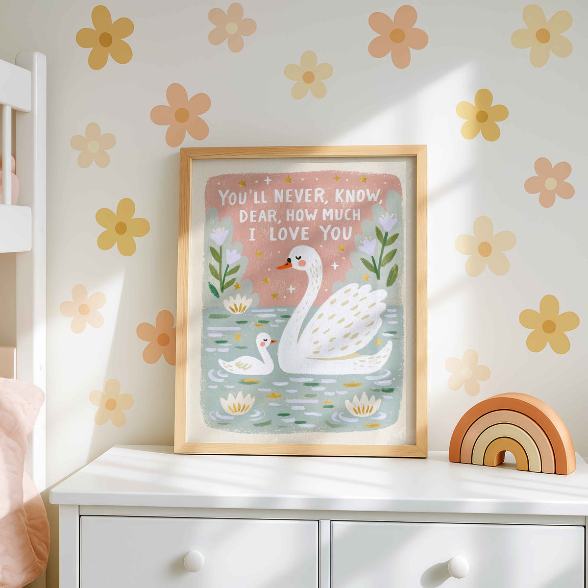 Retro swan and cygnet wall art with golden stars in a blush pink sky