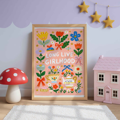Retro tea party wall art with a teapot, a flowered teacup and bows on peach pink, lettered Long Live Girlhood