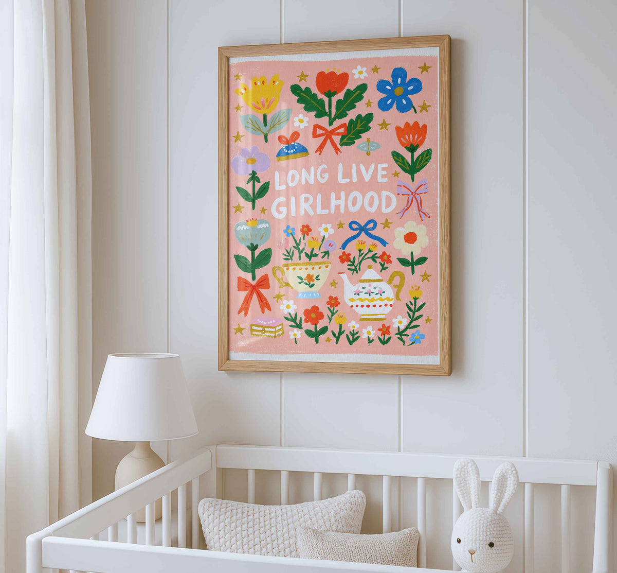 Retro wall art featuring a teapot with a gold handle and a flowered teacup