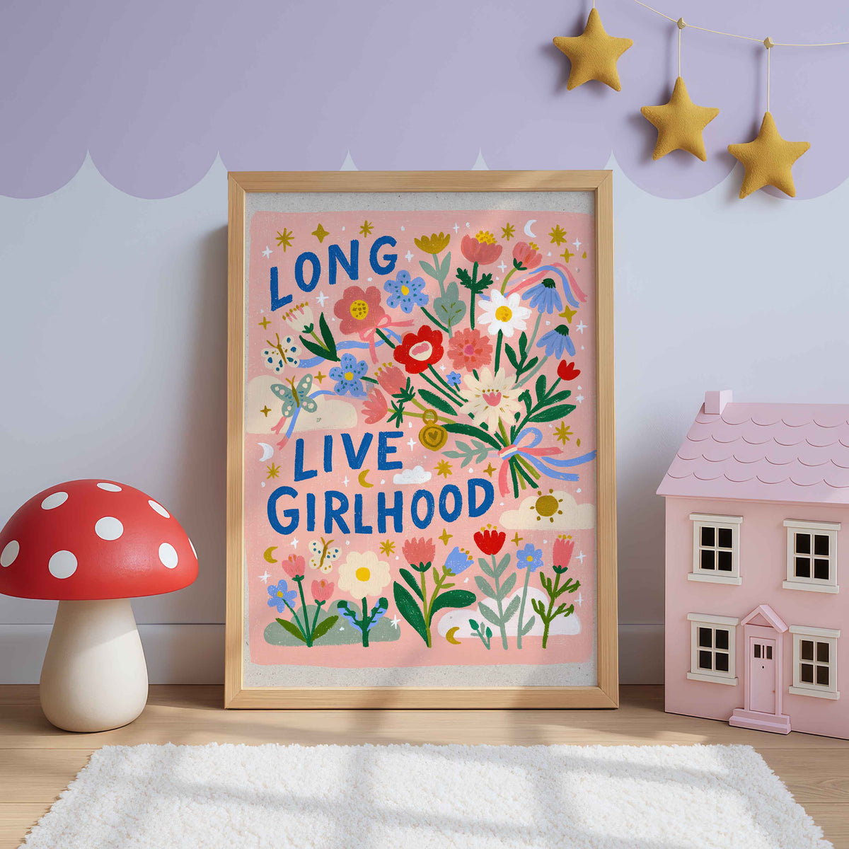 Retro wildflower wall art with a ribbon tied bouquet, butterflies and stars on pink, lettered Long Live Girlhood