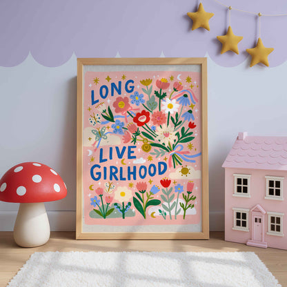 Retro wildflower wall art with a ribbon tied bouquet, butterflies and stars on pink, lettered Long Live Girlhood