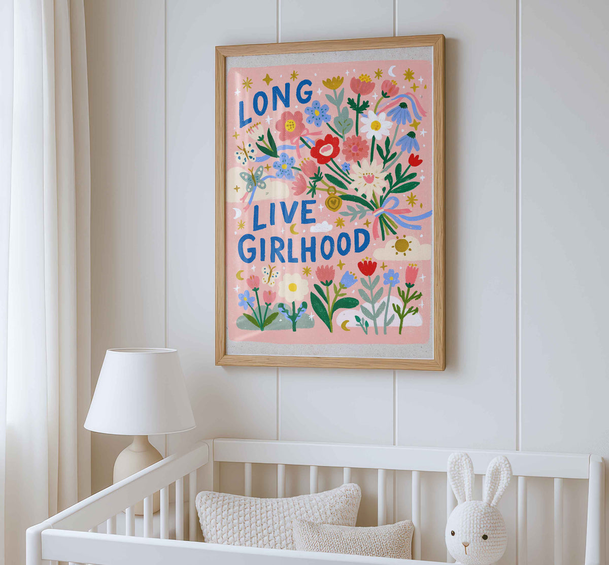 Retro wall art featuring a bouquet tied with pink and blue ribbons