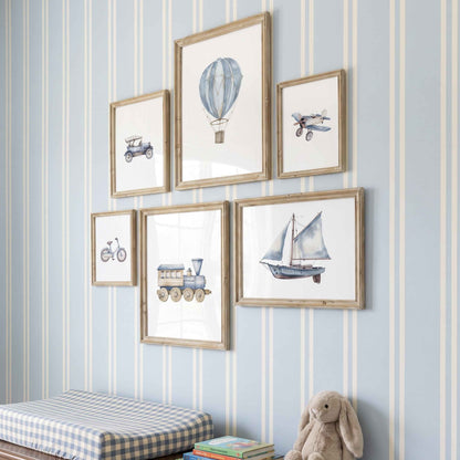 6 piece vintage blue transportation nursery wall art set featuring planes, trains, boats and hot air balloon