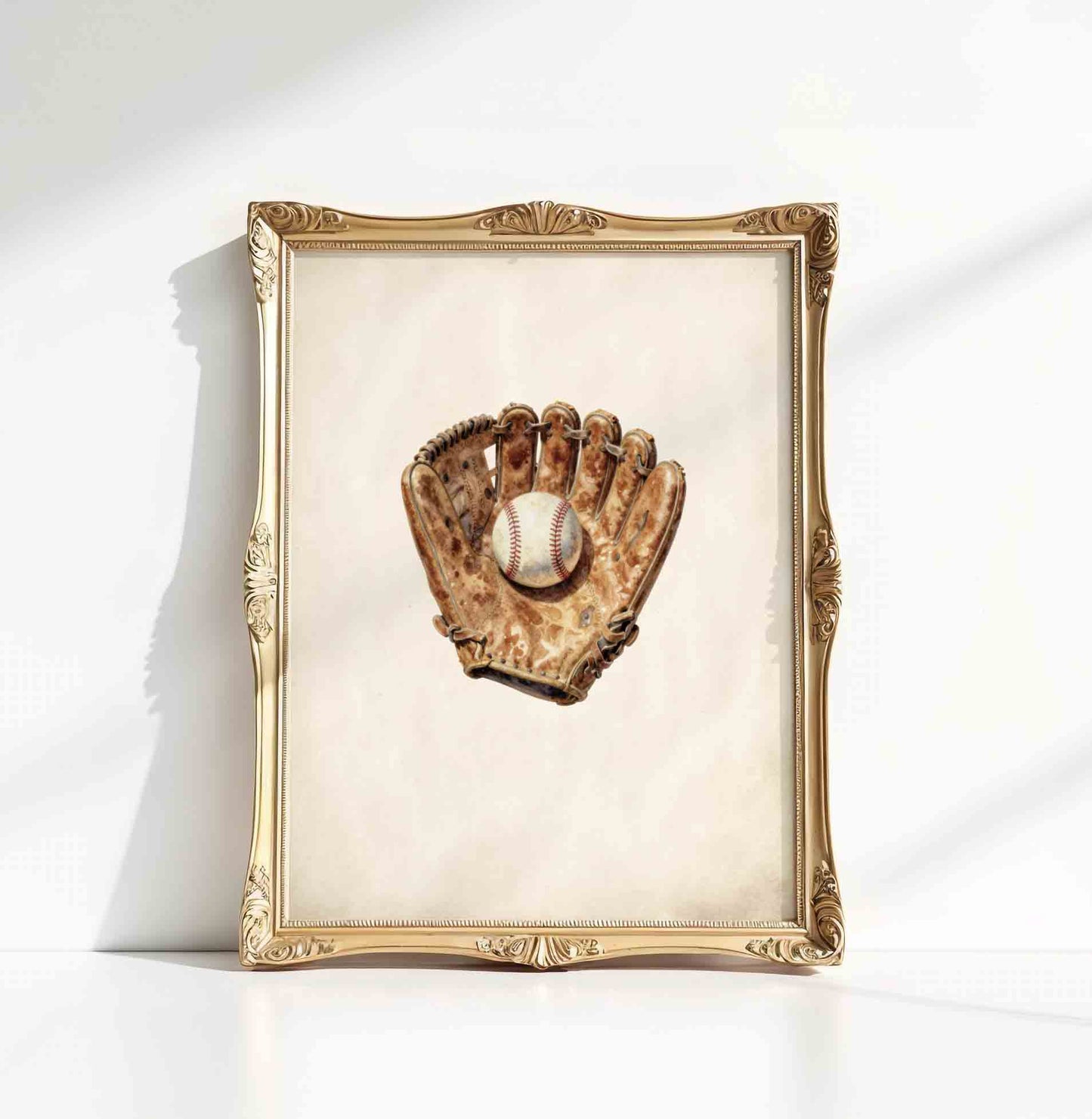 Watercolor baseball glove print in a gold frame styled for a boys nursery room