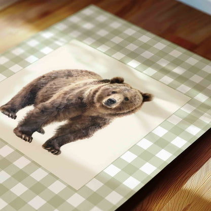 Watercolor bear print on sage gingham styled on a table for a woodland nursery room