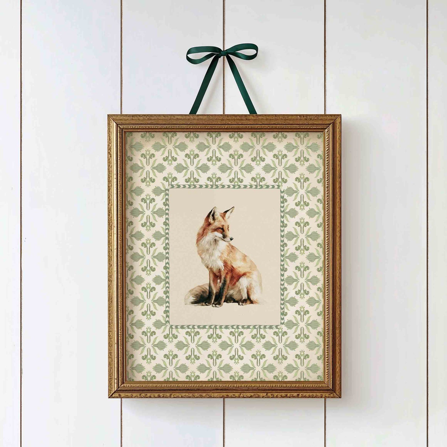 Watercolor fox print on gingham background styled for a woodland nursery room