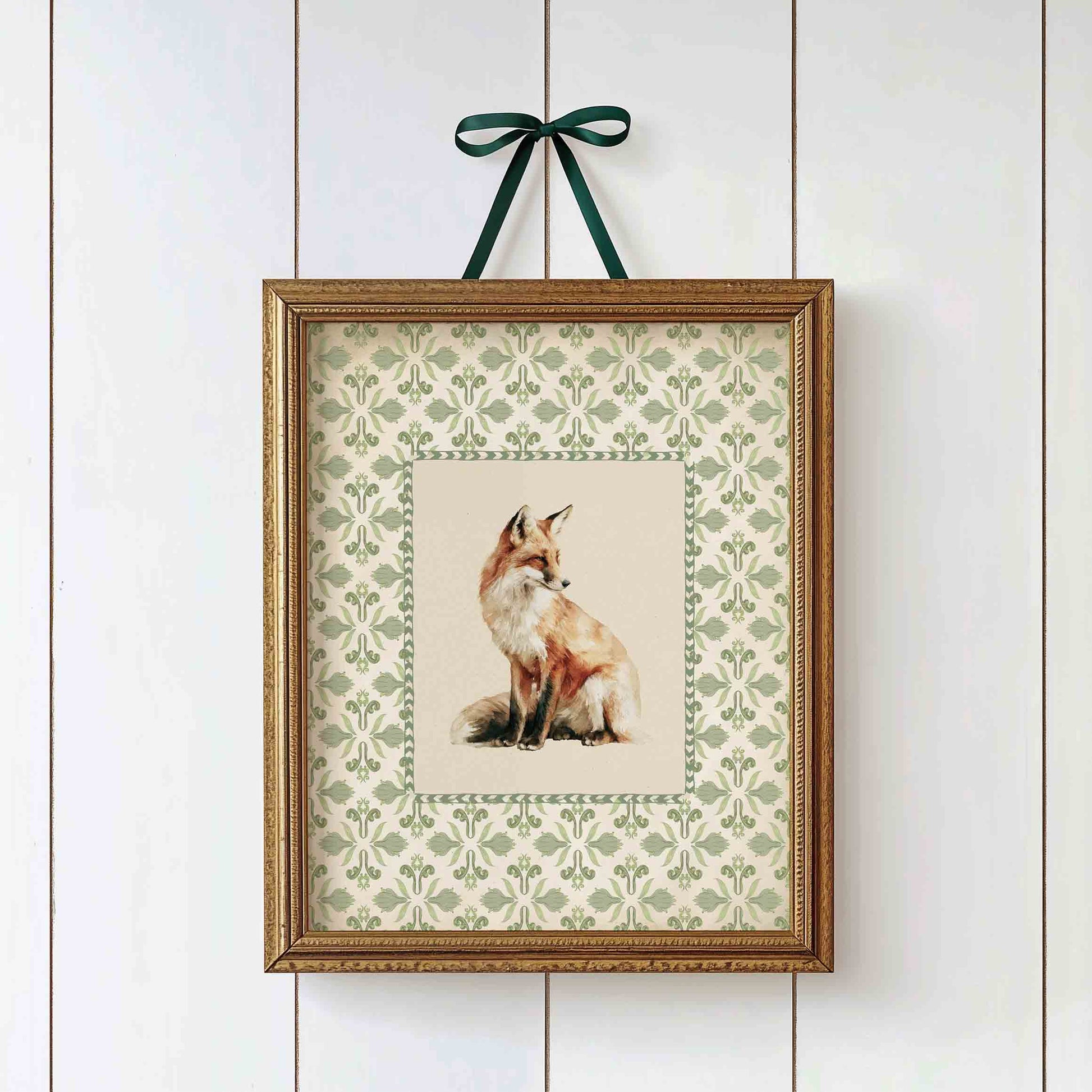 Watercolor fox print on gingham background styled for a woodland nursery room