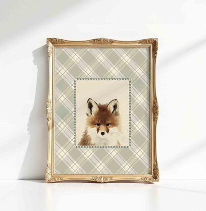 Watercolor fox portrait in an ornate gold frame styled for a woodland nursery room
